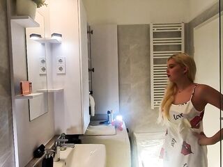 Hot girl cute blond sexually excited beauty in pink pants and with a satin nightie does the baths routine previous to gonna the couch