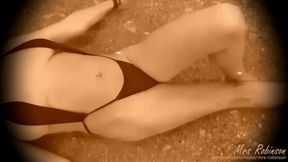 Flirty 1920s babe strips off bikini on the beach