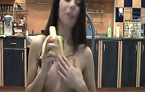 Naughty brunette with a banana on webcam