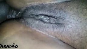 Tight black booty overflows with thick cream