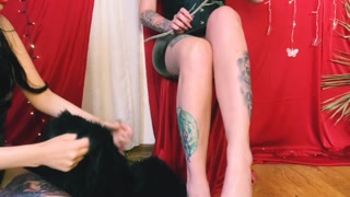 Foot fetish. Washing Dominatrix's legs and feet, wiping her feet with fur.