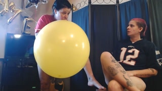 Lesbians Blowing up Big Yellow Balloon Superbowl Party Prep
