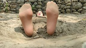 Buried in the sand Alicia with pantyhose and tickled feet (2)