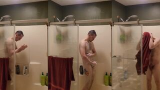 Inked up dude gets caught in the shower & tugged while washing his body