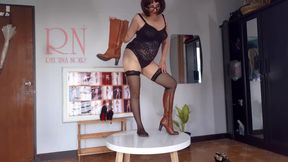 Regina Noir trying on high heels. Striptease in lingerie and stockings