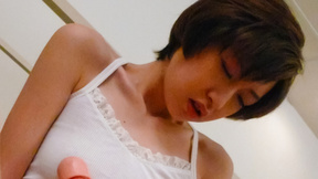 Short-haired Japanese female Akina Hara tests her new realistic dildo