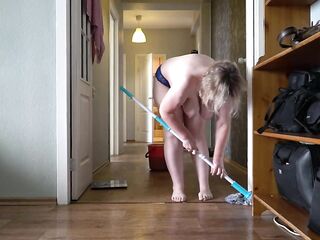 A aged, corpulent mother i'd like to fuck with large, natural, saggy breasts is cleaning the apartment.