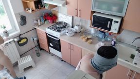 An amateur couple is having fun in the kitchen.