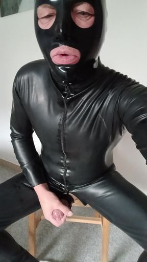 Cumshot in latex suit