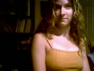 Captured webcam video of one amateur chick showing off her boobs and ass