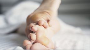 Callused feet relax in bed (720p)