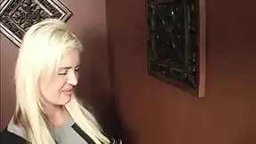 large-Titted Blonde MILF Sucks Cock at the Gloryhole