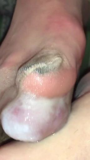 Jaw-dropping moment from &quot;Tan nylons footjob with cock trapped inside&quot;