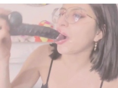 babe sucks and spits on a dildo