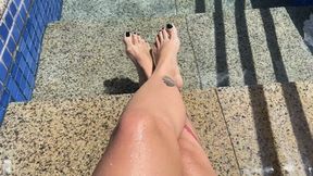 in the pool showing off her beautiful feet