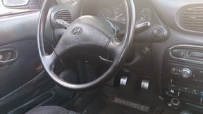 A beautiful lady driving a car and pumping the pedals (3)