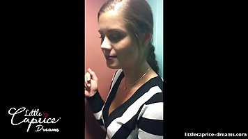 Fresh babe is having sex in a cinema center and sucking her partner's rock hard dick