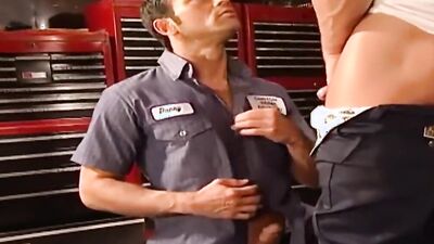 Robert Van Damme and his mate are shagging in the work shop