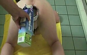 Ass stretched by speculum and filled with milk