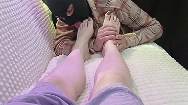 slave licks mistress's feet