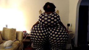 Breast and butt inflation in polka dot jumpsuit