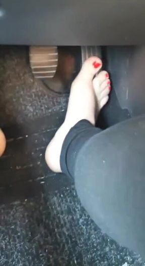 Driving instructor with sexy pedicure teaches how to drive
