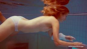 ”In the indoor pool, a satisfying hottie swims”