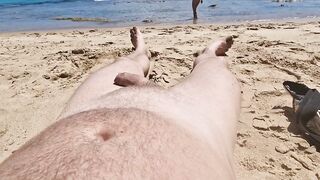 Stepsister gives nude blowjob to stepfather on a public beach