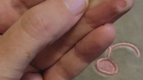 Big green booger playing in hand rubbing over fingers