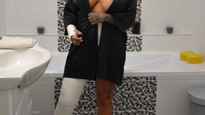 Naomi in the bathroom in big casts