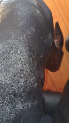 Dirty stained leather chaps and boots