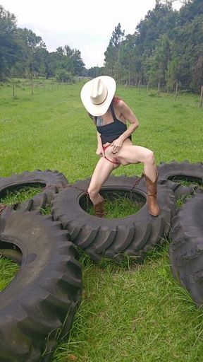 Redhead Cowgirl Peeees on Tractor Tires on Ranch