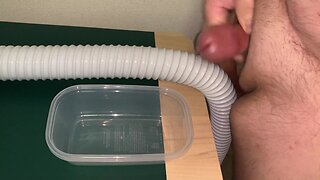 Man of large size urinating and ejaculating into a plastic container