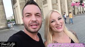 ”Bold Lovers Engage in Risky Public Passion at the Brandenburg Gate”