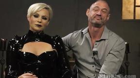 ”Blonde dominatrix playing with her slave”