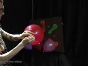 Nicky as a superhero destroys balloons