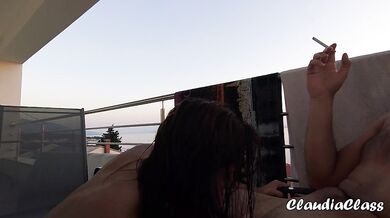 class smokes cock while sunbathing on balcony