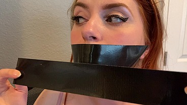 Cute Redhead Dirty Talks Through Her Duct Tape Gag!