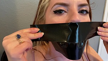 Cute Redhead Dirty Talks Through Her Duct Tape Gag!