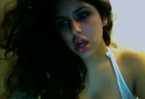 Beautiful and busty curly haired brunette on webcam