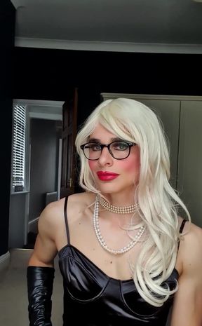 Teasing you in my black satin dress, full make up, pearls, opera leather gloves, stockings, suspenders, pearls, chastity, blonde