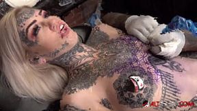 Inked Amber Luke plays with toys while getting tattooed
