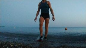 Alexa Cosmic Swimming in the Sea After Sunset in Clothes. Wetlook in Sneakers, Shorts and T-shirt