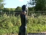 Rubber Girl Full in Black Latex Catsuit and Mask Plays with herself Outdoor in a Meadow - Part 4