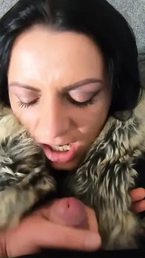 Busty MILF blows and cums all over her black fur coat