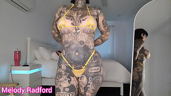 Heavily Tattooed Blonde Mom tries on micro bikinis and poses