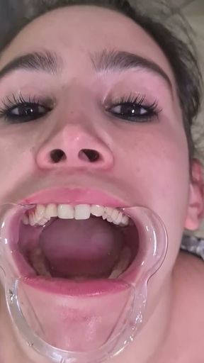 French maid tries to swallow her own piss through lip retractor   Clip 2