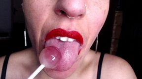 sucking & licking on a lollipop while talking you through hotness