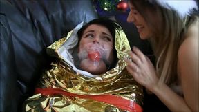 Ball Gagged Girl Wrapped Up As A Mummified Christmas Present
