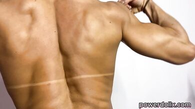 Female Fitness Model Flexes Huge Biceps & Back Muscles